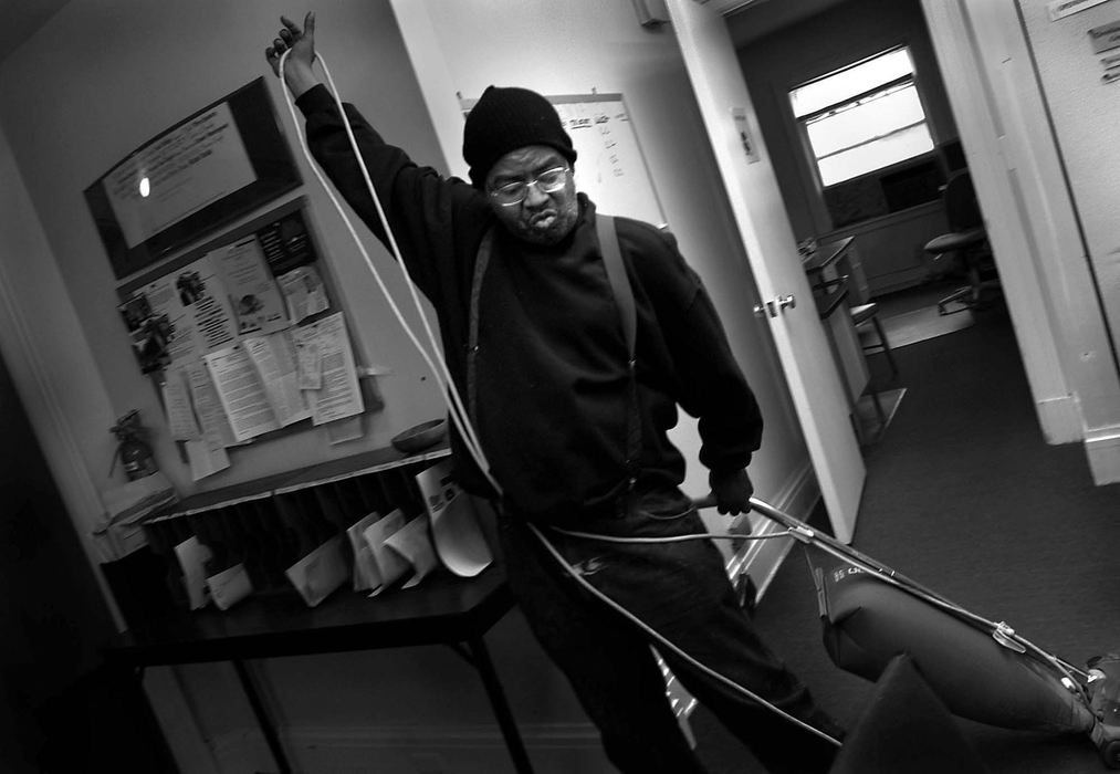 Third Place, Photographer of the Year - Dale Omori / The Plain DealerDerrick Glover sweeps at Magnolia Clubhouse.  Members tackle the daily chores such as housecleaning and working in the kitchen.  Even simple tasks can be challenging for people with a serious mental illness.