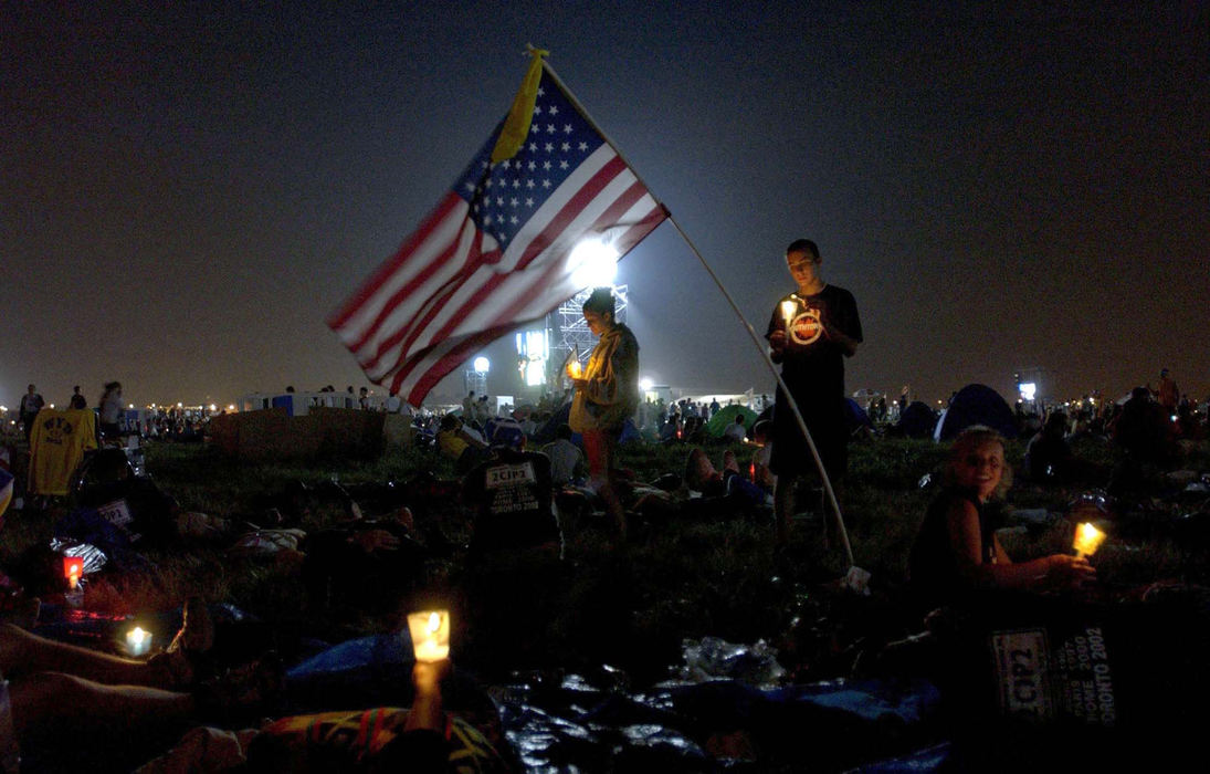 Third Place, Photographer of the Year - Dale Omori / The Plain DealerAmerican kids attend vigil at  World Youth Day before a mass with Pope John Paul II, Toronto, Canada, July 27, 2002. 