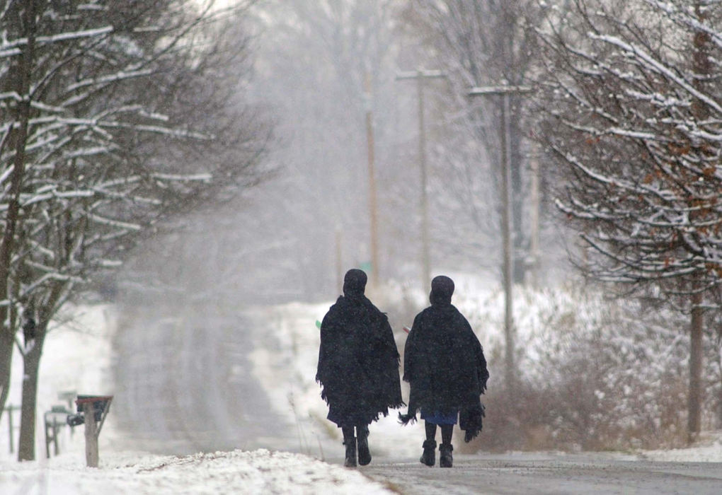 Award of Excellence, Photographer of the Year - Amy Sancetta / Associated PressTwo amish girls walk home from school on a snowy  afternoon in Mesopotamia on Jan. 7, 2002.