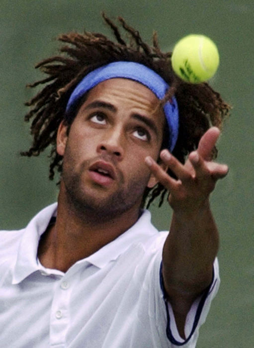 Award of Excellence, Photographer of the Year - Amy Sancetta / Associated PressJames Blake of the United States serves to Australia's Lleyton Hewitt Aug. 31, 2002, at the U.S. Open tennis tournament in New York. 