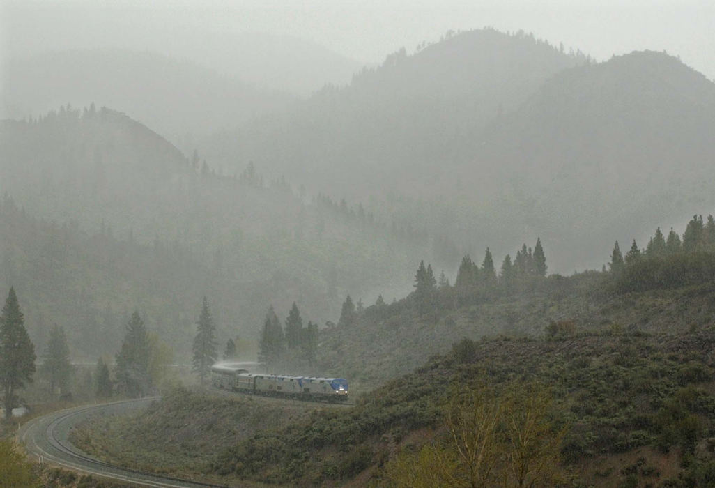 Award of Excellence, Photographer of the Year - Amy Sancetta / Associated PressAmid a rain and hail storm, the westbound California Zephry begins its ascent of the Sierra Nevadas in Farad, Ca. on April 26, 2002.