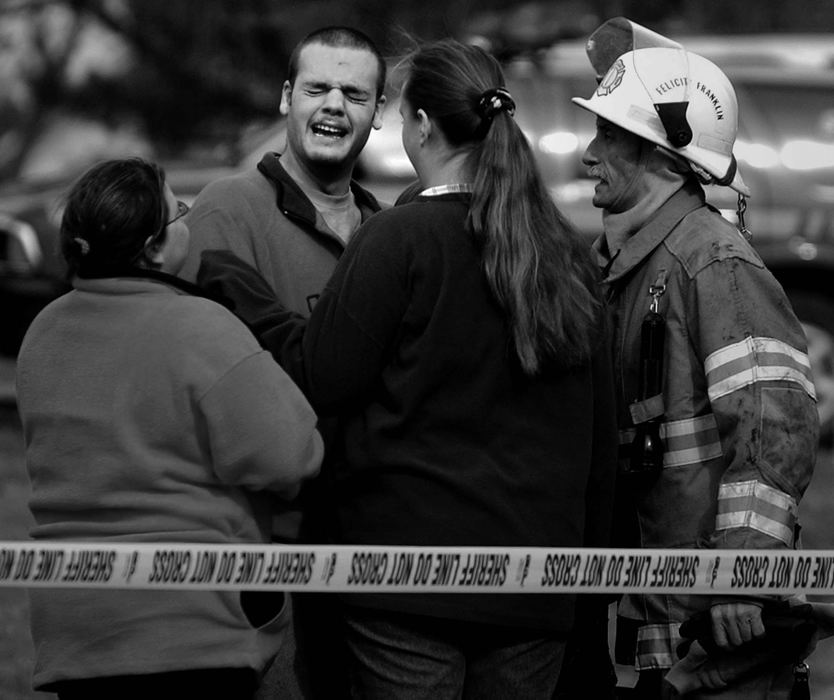 Award of Excellence, Photographer of the Year - Michael E. Keating / Cincinnati EnquirerJason Minton cries as he is told his "best friend" died while trying to rescue a young girl from an early morning house fire. Minton arived on the scene about two hours after the fire was under control.