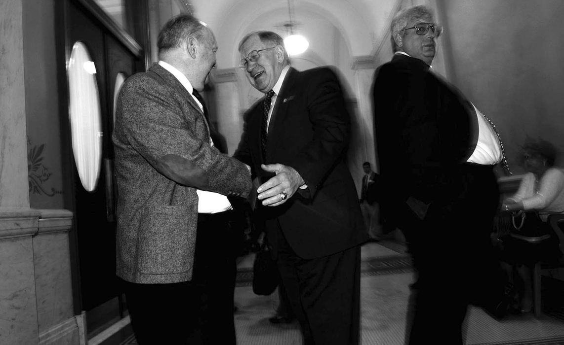 Award of Excellence, Photographer of the Year - Michael E. Keating / Cincinnati EnquirerRetiring State Senate President Richard Finan (center) greets a banking lobbyist in the gallery outside the Statehouse Senate chamber. Another lobbyist awaits his chance to press the flesh.