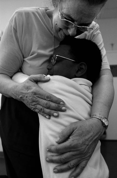 Award of Excellence, Photographer of the Year - Michael E. Keating / Cincinnati EnquirerFirst grader Karim Laury gives teacher Nancy Bitter a hug. Said Ms. Bitter, "After my husband passed away I know I'll get all the hugs I need here (at school) everyday." 