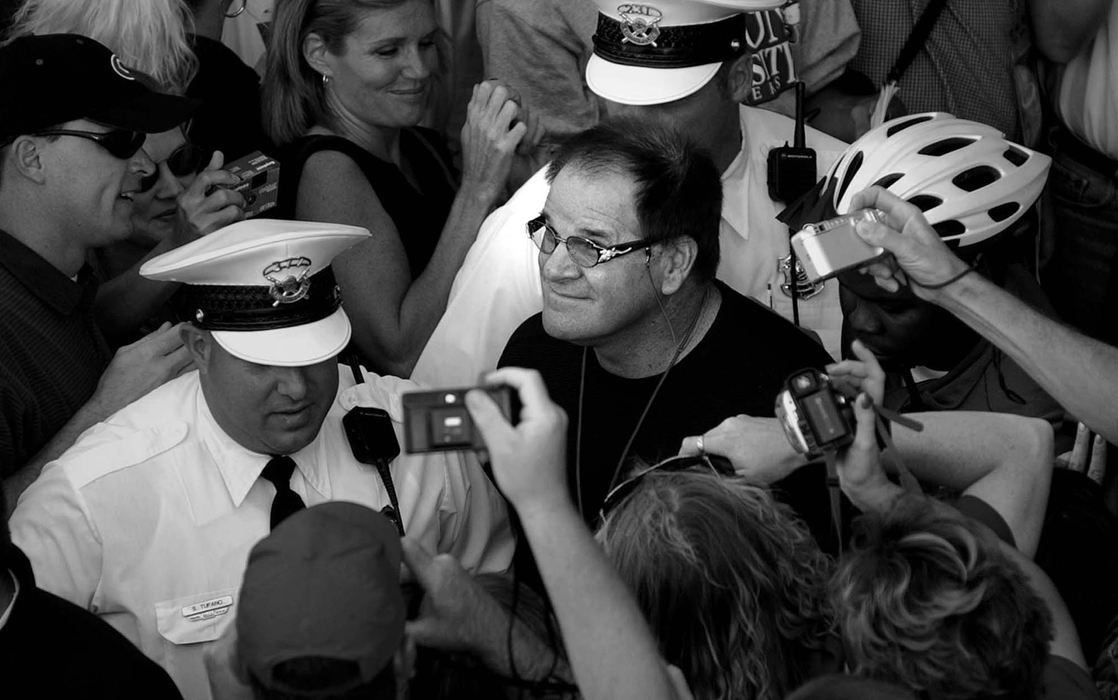 Award of Excellence, Photographer of the Year - Michael E. Keating / Cincinnati EnquirerPete Rose is ushered into the stadium under police escort.  Someone in the crowd noted that "Rose hadn't been under the protection of so many cops since he was incarcerated for tax evasion" a decade earlier.