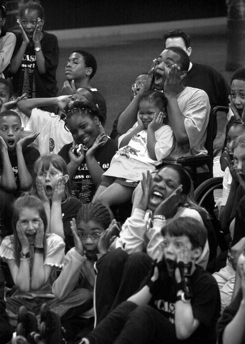 First Place, Photographer of the Year - Ed Suba, Jr. / Akron Beacon JournalHis life returning a bit to that of a normal 11-year-old, Leroy and his fifth grade classmates from Case Elementary school mug for the camera while attending the annual class roller skating party at Rocky's Skating Center in Tallmadge. The 11-year-old Akron boy lost both his legs on the morning of December 7, 2001 after being pulled beneath a train while walking to school with his brother, Tony.  