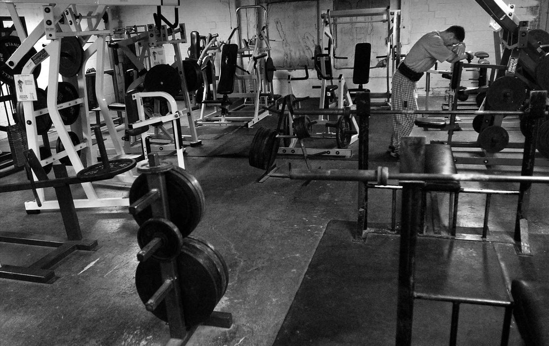 First Place, Photographer of the Year - Ed Suba, Jr. / Akron Beacon JournalBodybuilding is a solitary sport when it comes to training and diet. Akron firefighter Doug Price is alone with his thoughts as he rests between exercises at the gym. Price works out twice a day, once in the morning and again in the afternoon. Price is a bodybuilder who has been training for the last year preparing for the 2002 Canton Bodybuilding competition. It will be Price's first contest and he will be competing against bodybuilders from all over the state of Ohio.