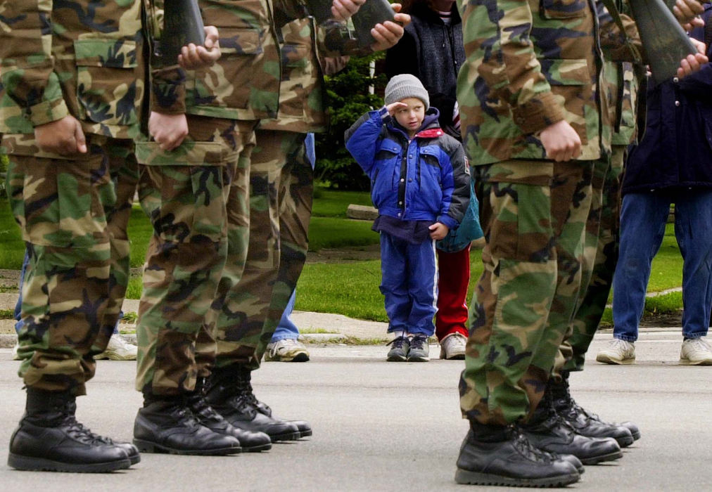 Second Place, Photographer of the Year - John Kuntz / The Plain DealerJoseph Messina,5, of Parma salutes as a group of US Marines march down Ridge Road in Parma May 18, 2002 during the Armed Forces Day Parade.  Units from all branches of the military join veteran's groups to parade through Parma in honor of the 2 million members of the US armed forces. 