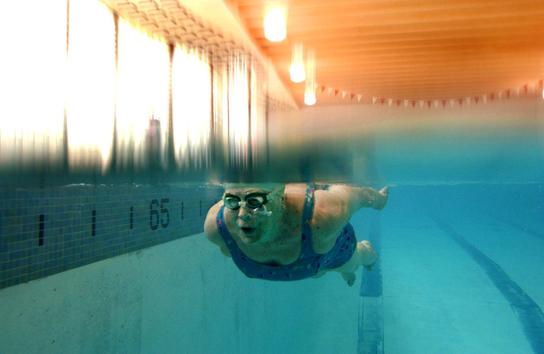 Second Place, Photographer of the Year - John Kuntz / The Plain DealerPhyllis Lehman,90, swims laps during the aquadames swim club April 18, 2002 at the Southland YWCA.  The aquadames has been swimming together since 1956 where they swim laps, play water volleyball and socialize.  Phyllis Lehman, 90, swims laps weekly at the Southland YWCA as a member of the Aqua Dames, a club founded in 1956. Most of the members are in their 70s and 80s.