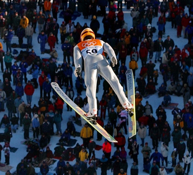 Second Place, Photographer of the Year - John Kuntz / The Plain DealerGerman ski jumper Stephan Hocke soars through the air during the K120 qualifying jumps as a sold out crowd watches his flight February 12, 2002 during the 2002 Winter Olympic Games at the Utah Olympic Park venue.  qualification jumps. Hocke qualified for today's finals.   