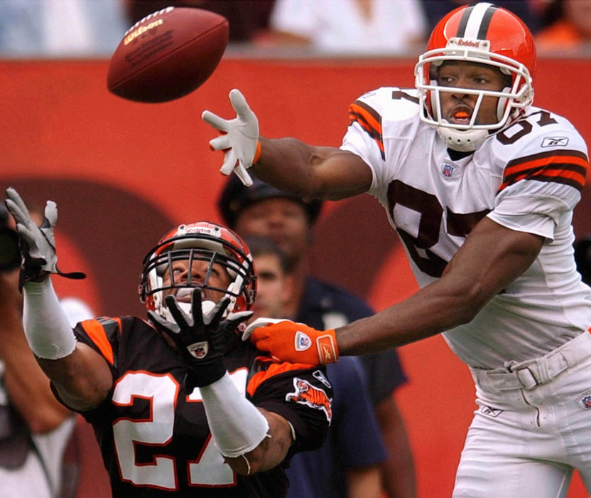 Award of Excellence, Sports Action - Bob DeMay / Akron Beacon JournalCleveland Browns wide receiver Andre Davis (right) turns defender as he bats a pass away from Bengals defensive back Artrell Hawkins in the end zone. 