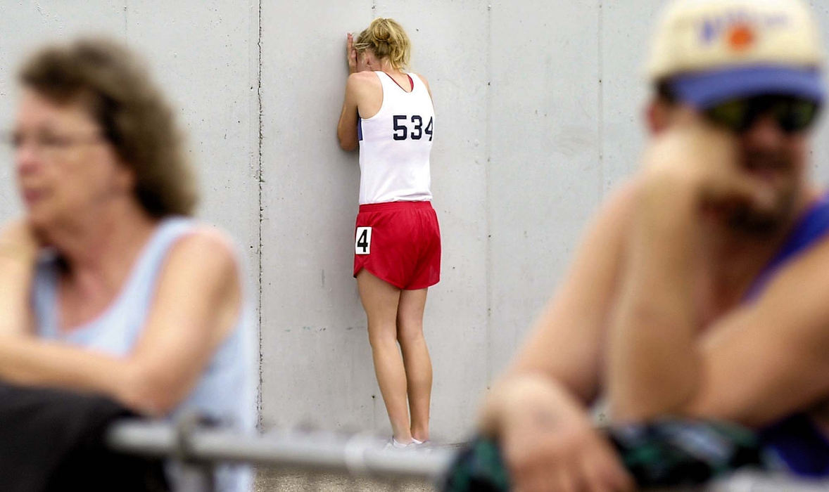 Award of Excellence, Sports Feature - Tim Norman / Suburban News PublicationsWorthington Thomas' Molly Beckwith cries after being disqualified in the semifinal 400-meter dash during the State Track & Field Tournament at Welcome Stadium in Dayton on Friday. Beckwith was disqualified after a false start.