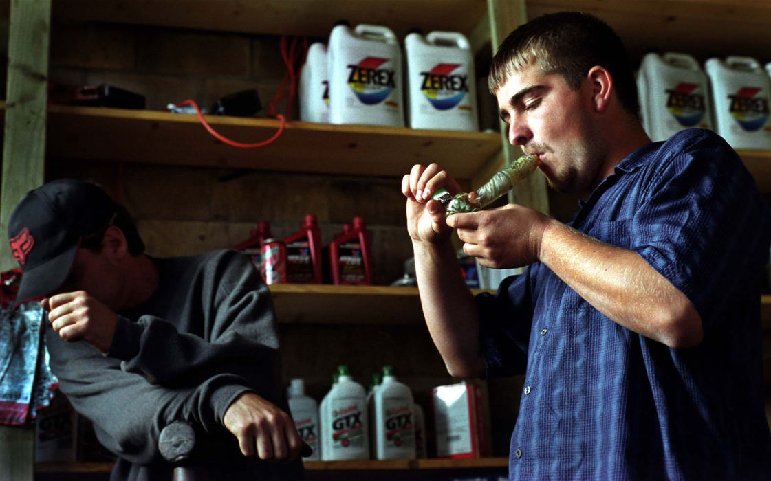 First Place, Student Photographer of the Year - James Patterson / Ohio UniversityAdam smokes marijuana with his mechanic and friend Rodney Richmond in the back of the auto shop. After being diagnosed with bipolar disorder in rehab, Adam refused to take his prescriptions. “Weed is my only medicine,” he says.