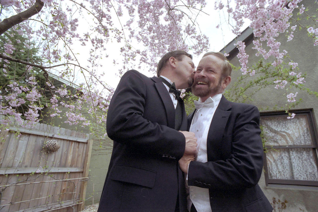 Second Place, Student Photographer of the Year - David Distelhorst / Ohio UniversityBrad Colegate gives his partner Jim Mitchell a kiss in the backyard of their Columbus home. The two have been together for over seven years, however can not be married in Ohio.