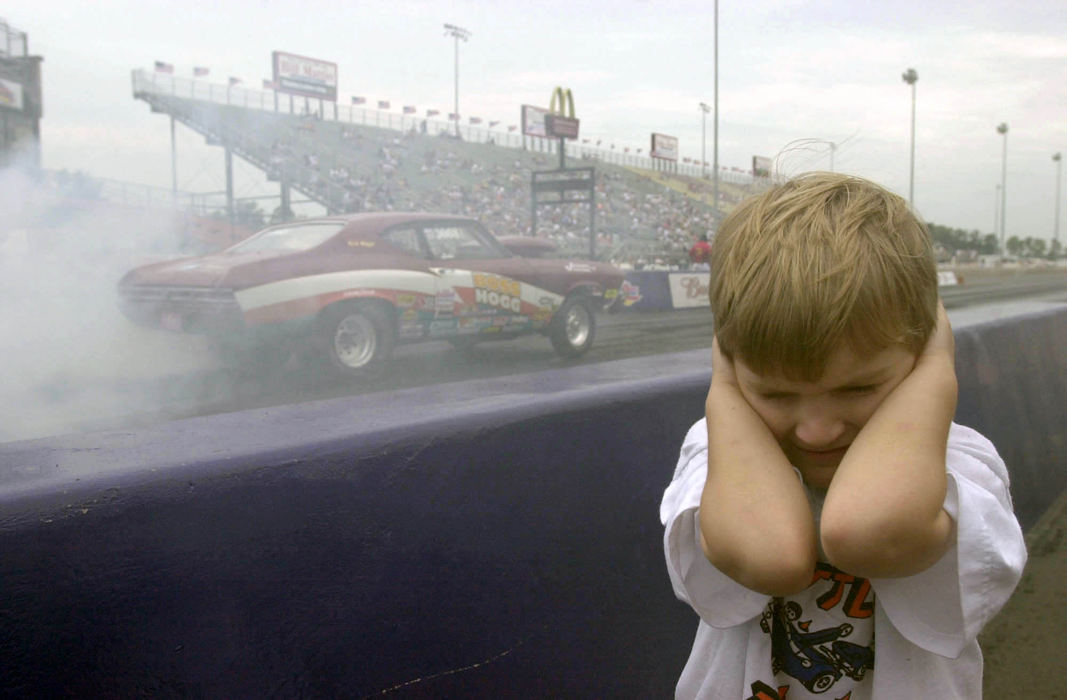 Second Place, Student Photographer of the Year - David Distelhorst / Ohio UniversityCody Kershaw, 5, of Erie Pennsylvania covers his ears from the sound of a car making its way down the track at Norwalk, July 7, 2002. His father, James Kershaw, raced in the Bracket One race at the Super Chevy Show.