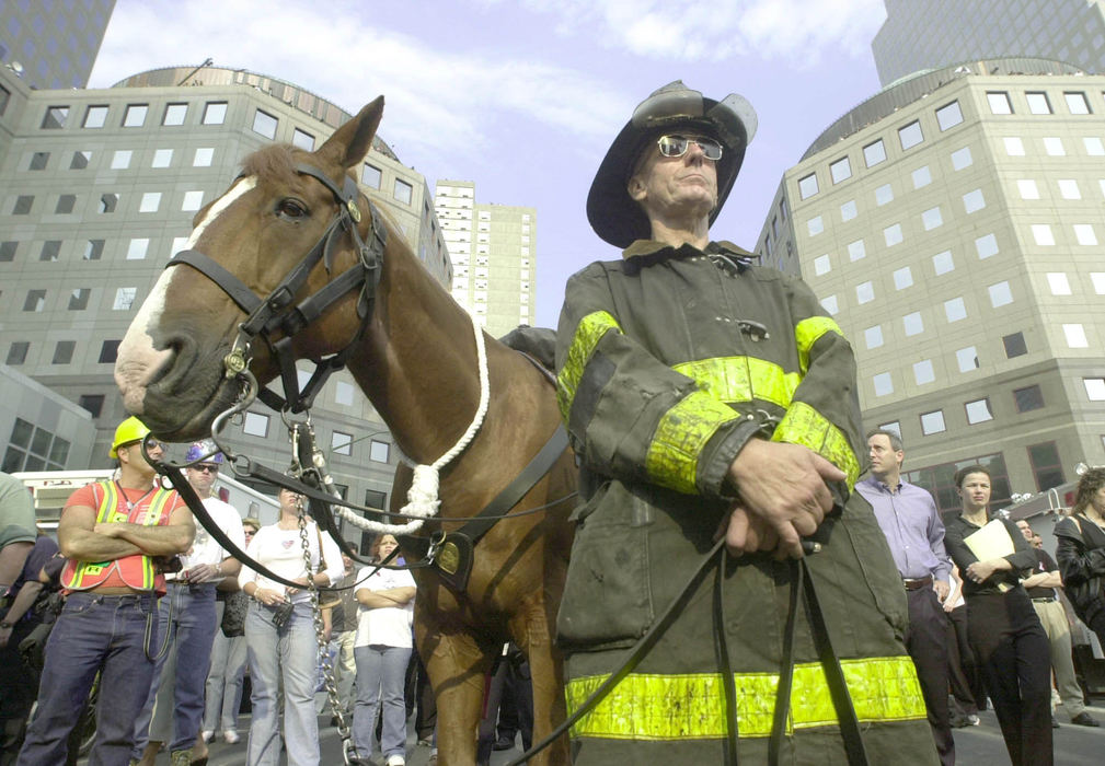 Second Place, Student Photographer of the Year - David Distelhorst / Ohio UniversityRetired New York Fire Fighter Tom Strong with his horse Jake honor the lost fire fighters during ceremonies to commemorate the one year anniversary of the attack on New York, September 11, 2002. 