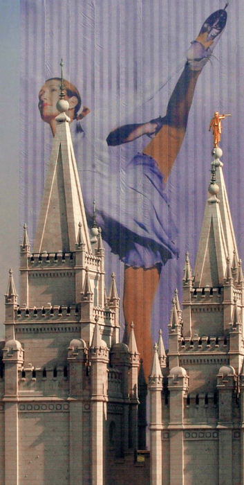 Second Place, Sports Picture Story - John Kuntz / The Plain DealerThe tops of the spires of the Mormon Tabernacle in downtown Salt Lake City contrast the skater mural hanging from the Mormon administration building February 6, 2002 as the approach of the 2002 Winter Olympic Games opening ceremony.   The compilation of images bring the sense of competition, beauty and action of the Winter Olympic Games.  