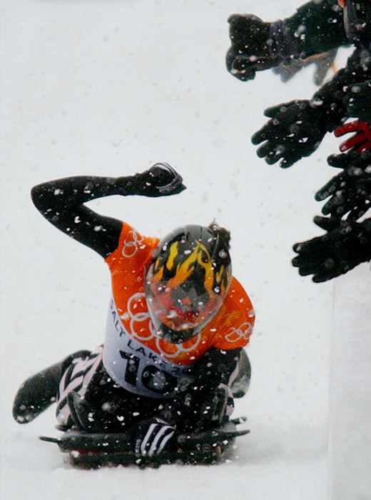 Second Place, Sports Picture Story - John Kuntz / The Plain DealerUnited States' Lea Ann Parsley celebrates her silver medal skeleton ride as fans hold their hands out for a high five February 20, 2002 at the Utah Olympic Park venue during the 2002 Winter Olympics.  