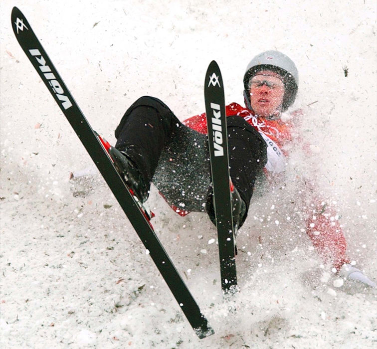 Second Place, Sports Picture Story - John Kuntz / The Plain DealerUnited States' Eric Bergoust falls on the landing of his gold medal freestyle aerial jump and finished in last place February 19, 2002 at the Deer Valley Resort venue during the 2002 Winter Olympic Games.  A clean landing would of assured Bergoust of a medal.   