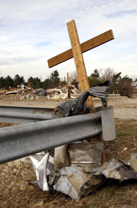 Third Place, Team Picture Story - Andy Morrison / The BladeTwisted steel and a makeshift cross are just about all that's left of the Christian Church in the destroyed town of Roselms.