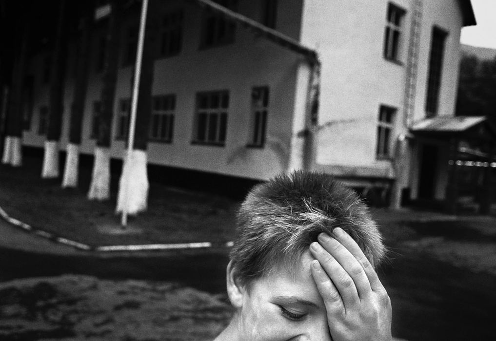 Third Place, Feature Picture Story - Greg Ruffing / FreelanceAlina, age 13, outside the facility where she stays. Many of the institutions across Ukraine are in dilapidated former military barracks or workers housings, often without reliable heating, water or electricity.