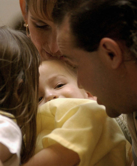 Award of Excellence, Feature Picture Story - Daniel Melograna / The News JournalThe Ervin Family huddle around Luke after he wakes up from his MRI Friday, May 16, 2003 at Children's Hospital in Columbus.