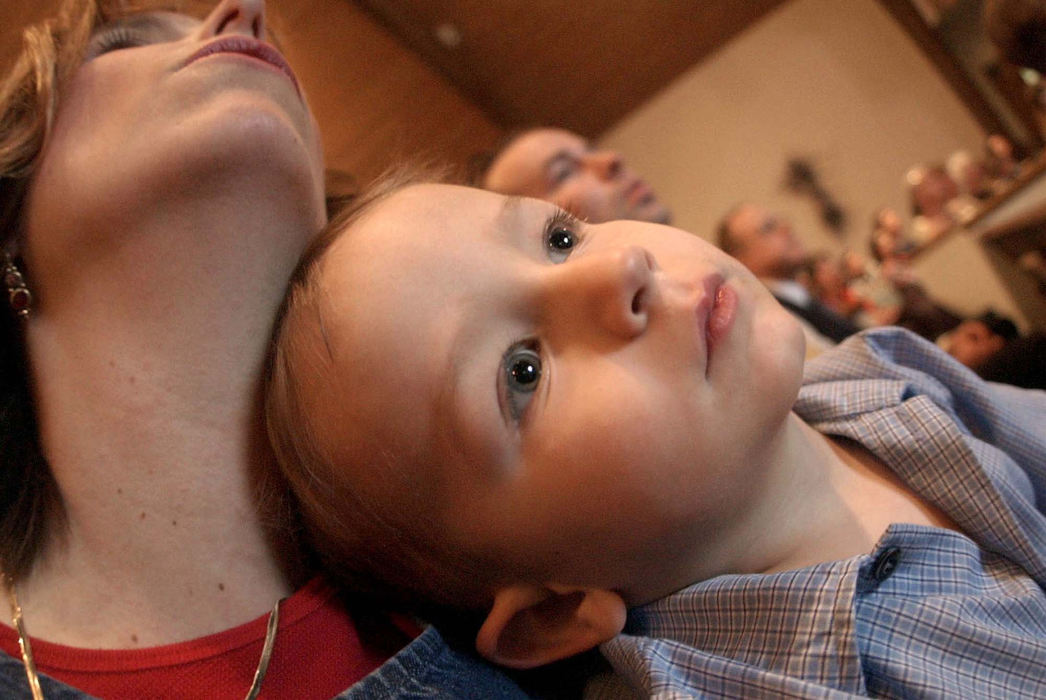 Award of Excellence, Feature Picture Story - Daniel Melograna / The News JournalLuke Ervin, 2, listens as the choir signs Sunday, May 18, 2003 at Berean Baptist Church in Mansfield.