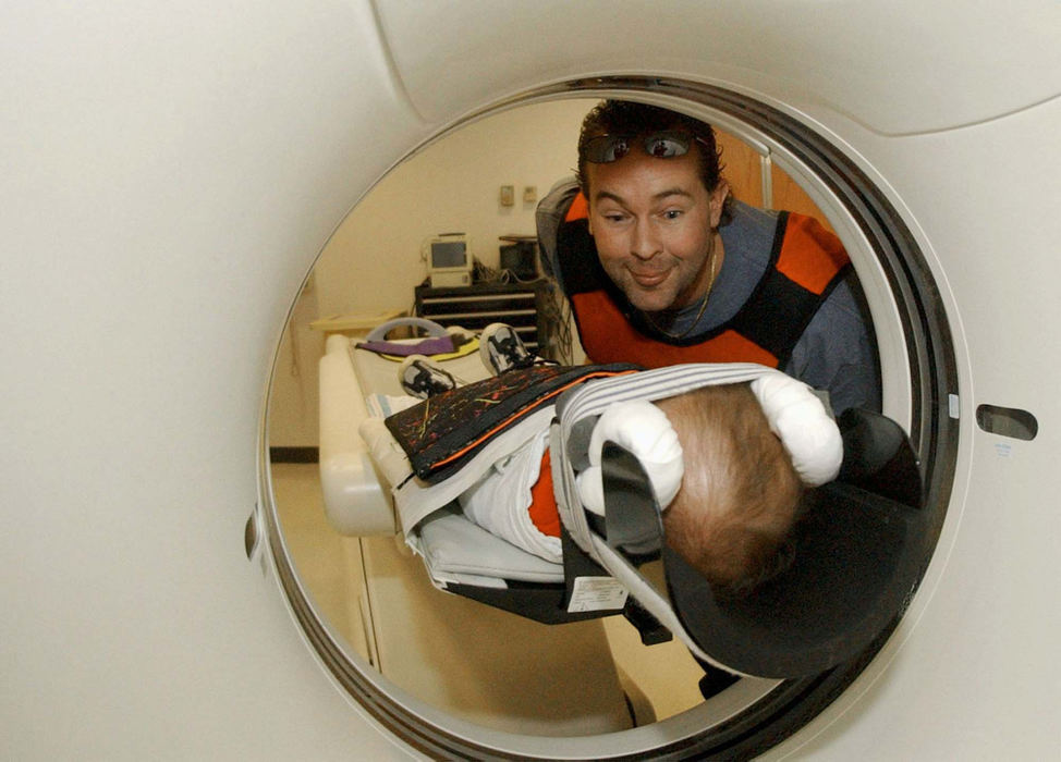 Award of Excellence, Feature Picture Story - Daniel Melograna / The News JournalMonte Ervin makes faces at his son, Luke, during a cat scan Friday, Feb. 14 at Children's Hospital in Columbus.