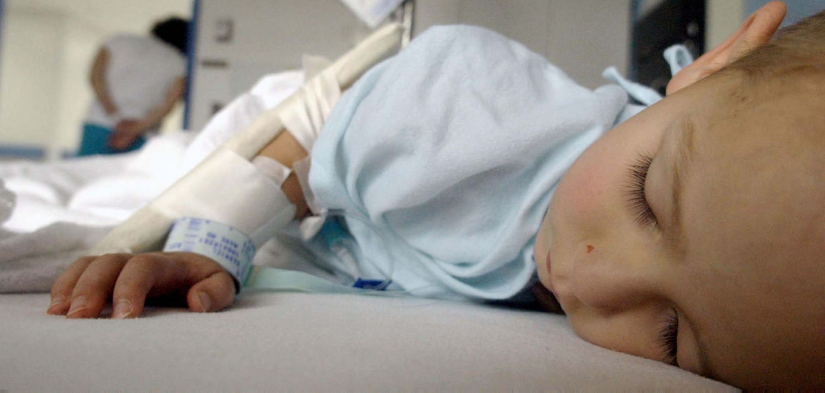 Award of Excellence, Feature Picture Story - Daniel Melograna / The News JournalLuke Ervin, 3, sleeps while he waits for the medical staff at Children's Hospital to come for him Tuesday, July 15, 2003  as his mother, Ivy, leans against the doorway to his room.