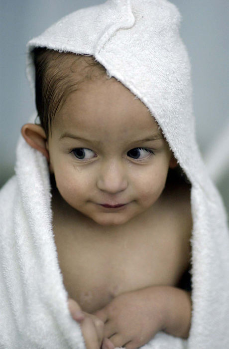 Award of Excellence, Feature Picture Story - Daniel Melograna / The News JournalLuke Ervin, 2, wraps himself in a towel Wednesday night as he takes a break from swimming at the Mansfield area YMCA.