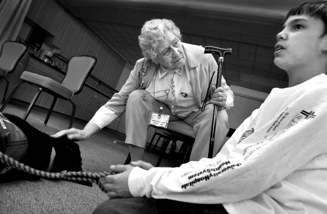 Award of Excellence, Feature Picture Story - Fred Squillante / The Columbus DispatchMabel McDonald listens as Eddie Hicks, right, talks about training Fonzie. McDonald is a resident of Wesley Glen retirement community, where the students take their dogs once a month.