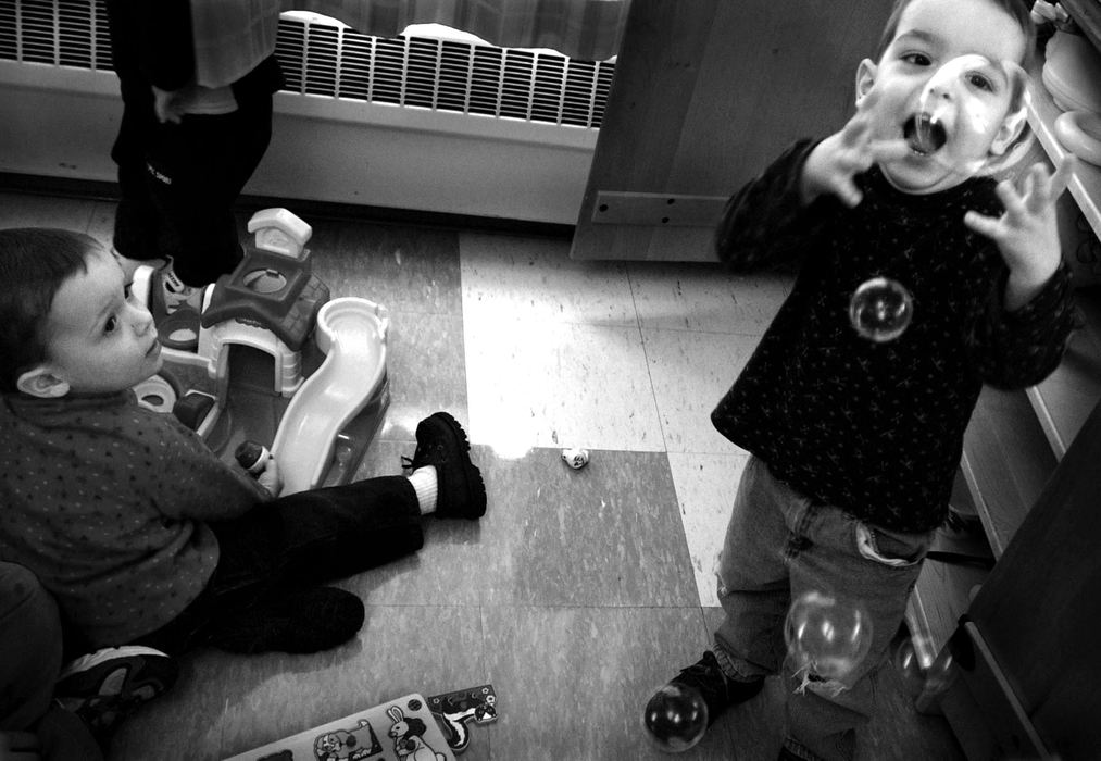 First Place, Feature Picture Story - Dale Omori / The Plain DealerPlay time is part of the therapy for Christophe, left, and his twin Henri.  Therapists taught the boys how to play with toys, an instinct lacking in many autistic children.  