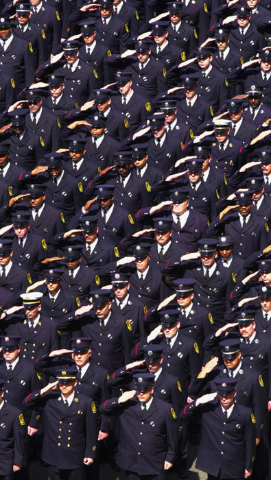 First Place, News Picture Story - Glenn Hartong / The Cincinnati EnquirerHundreds of firefighters attended the funeral for Oscar Armstrong, here is a mass salute as the casket is taken onto the church.                              