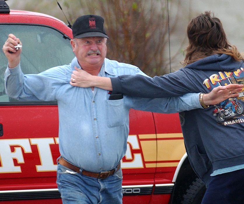 Second Place, News Picture Story - Carrie Cochran / Pulse-JournalJay Fisher, father in-law of Donald Haury, age 50 of Bellbrook, Ohio reacts right after Haury's sister-in-law Pamela Short tells him that Donald was fatally shot Thursday morning at Watkins Motor Lines, Inc. on Centre Park Drive in West Chester Township. Tom West surrendered to police at a truck stop in Indiana hours later. The shooting left three wounded and two dead.