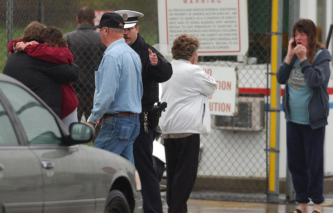 Second Place, News Picture Story - Carrie Cochran / Pulse-JournalDonald Haury's wife (in red), Haury's father in-law (blue denim shirt), Haury's mother in-law (white) and Haury's sister (blue) react at Watkins Motor Lines, Inc. on Centre Park Drive in West Chester Township. 