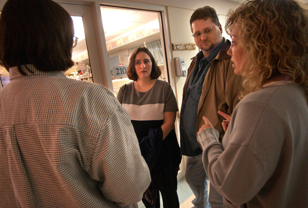 Second Place, Ohio Understanding Award - Bob DeMay / Akron Beacon JournalCathy and Dana talk with Dr. Harriet Feick, left, and Donna Patno while taking a tour of the neonatal intensive care unit at Children's Hospital. Feick is the neonatologist who will oversee their baby's care at Children's and Patno is the clinical case manager of the fetal treatment center.