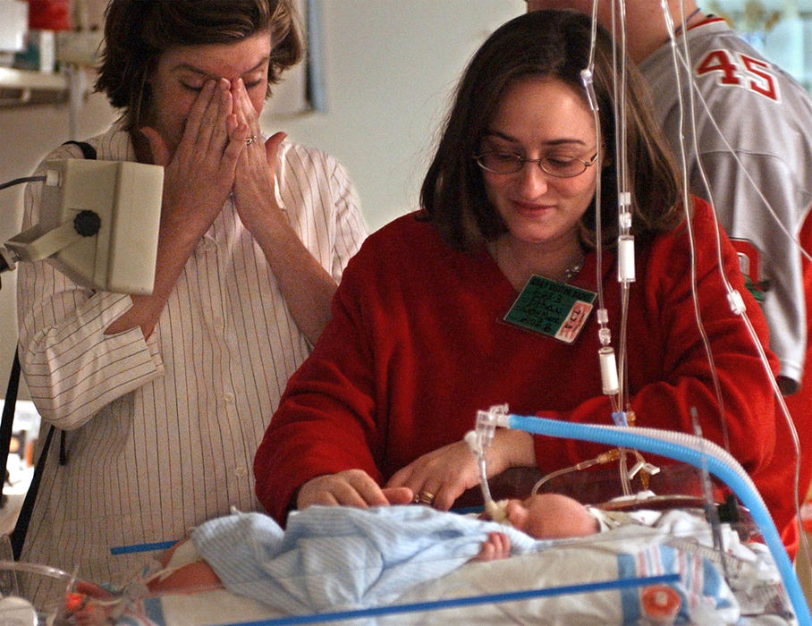 Second Place, Ohio Understanding Award - Bob DeMay / Akron Beacon JournalThe tears over Ethan this time are tears of joy as Cathy, and her sister-in-law Cindy Carney, left, see Ethan after he was disconnected from the heart-lung machine. Cindy Carney will deliver a baby of her own in two weeks. With disconnection from the ECMO machine, one hurdle is cleared. The next big one is fixing the hole in Ethan's diaphragm.