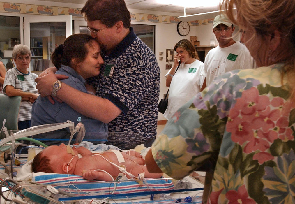 Second Place, Ohio Understanding Award - Bob DeMay / Akron Beacon JournalSurrounded by family Cathy and Dana embrace as they see Ethan following the surgery that repaired his diaphragmatic hernia. "I know he has a long way to go, Cathy says, "but I feel about the best I've felt in twenty weeks." "Let yourself be happy," says Dr Jeffrey Butler, smiling. "This was a good day."