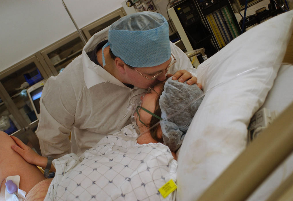 Second Place, Ohio Understanding Award - Bob DeMay / Akron Beacon JournalDana Moore kisses his wife Cathy moments after she delivered their son at Akron General Hospital on June 22. 