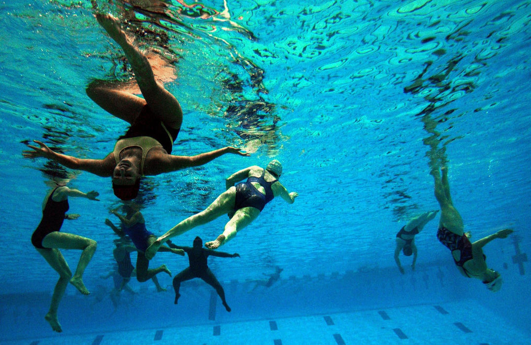 First Place, Photographer of the Year - Dale Omori / The Plain DealerWomen competing in the 2003 U.S. Masters Synchronized Swimming Championships warm up in the natatorium at Cleveland State University, Oct. 23, 2003.  