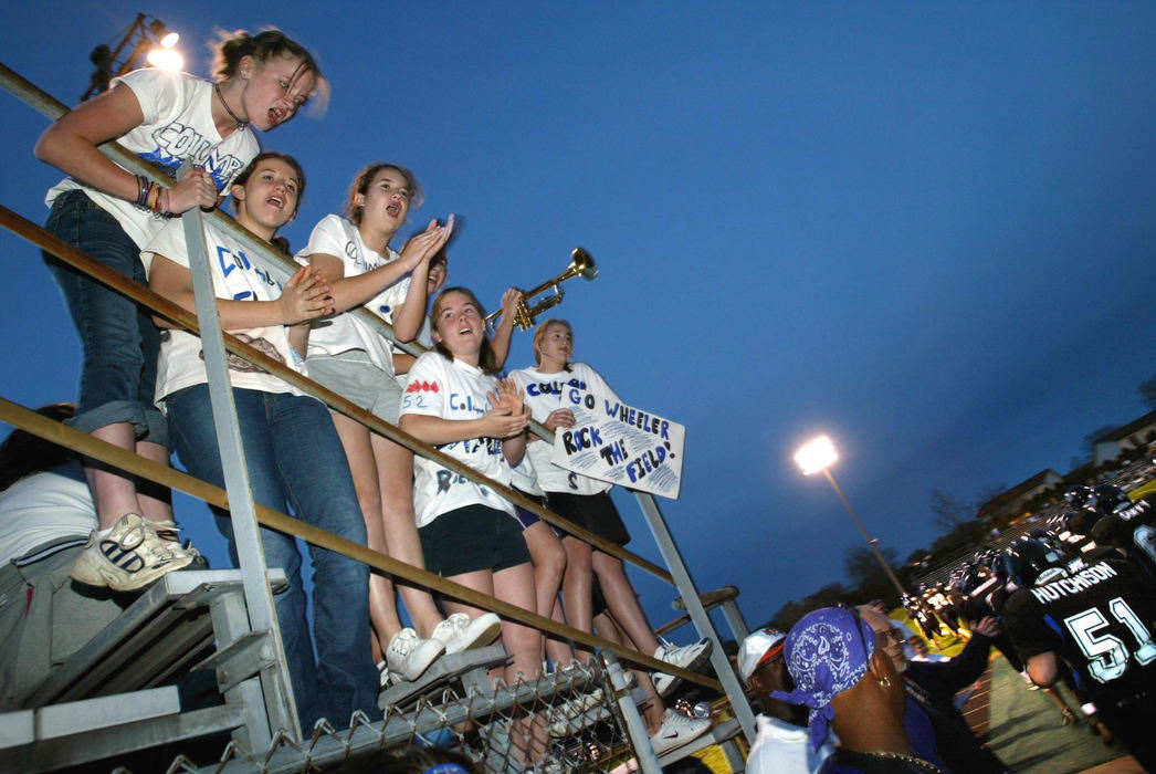 Third Place, Photographer of the Year - Fred Squillante / The Columbus DispatchGirls cheer the Flames as they return to the field after halftime.