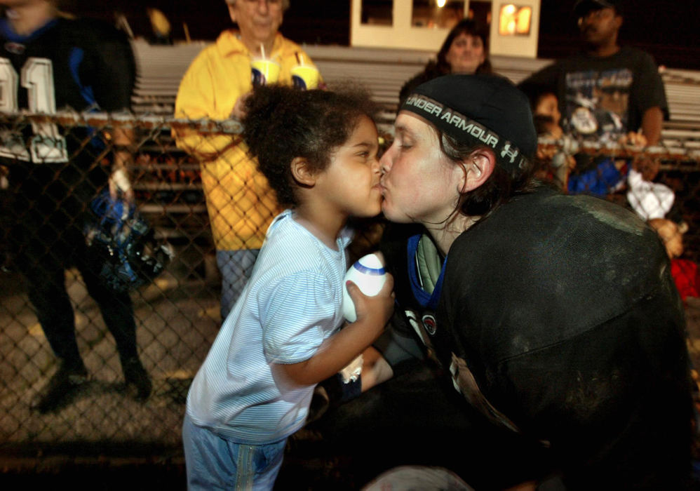 Third Place, Photographer of the Year - Fred Squillante / The Columbus DispatchThe Flames' Susan Nelson gets a kiss from her daughter, Savannah, 3, following a game against the D.C. Divas. 