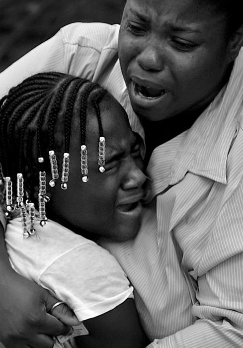 Award of Excellence, Photographer of the Year - Michael E. Keating / Cincinnati EnquirerDeandra James gives comfort to her daughter Jarelle after a metro bus crashed into their home. Ms. James arrived on the scene after following the crash and sought out her shaken but uninjured daughter.