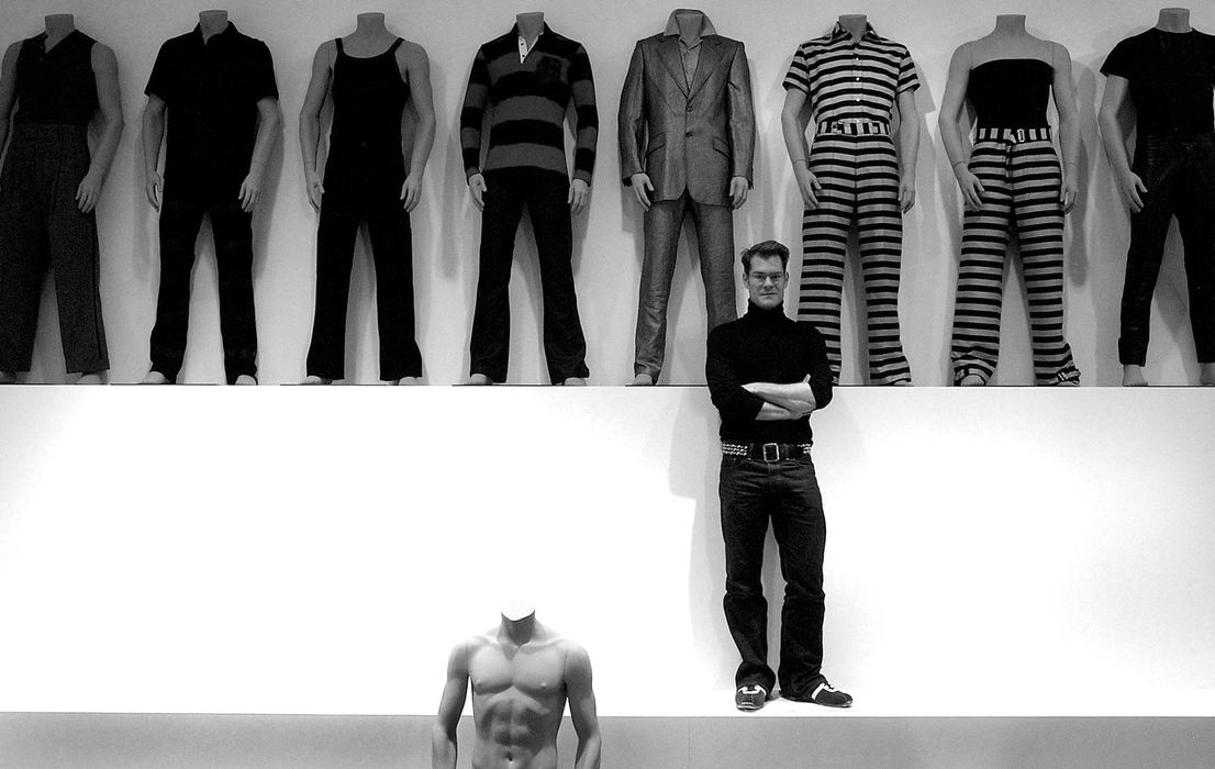 Award of Excellence, Photographer of the Year - Michael E. Keating / Cincinnati EnquirerDesigner John Bartlett stands amid his clothing designs during the installation of a show of his work at a museum.