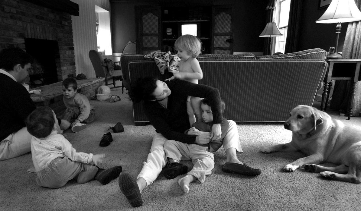 First Place, Photographer of the Year - Dale Omori / The Plain DealerSophia dresses Henri before she takes the three boys to preschool at the autism center.  Every day counts.  The week before, the boys missed four days of therapy because of ear infections.  "They lose (skills)," said Marc.  "It's tough." Margaux is behind Sophia. 