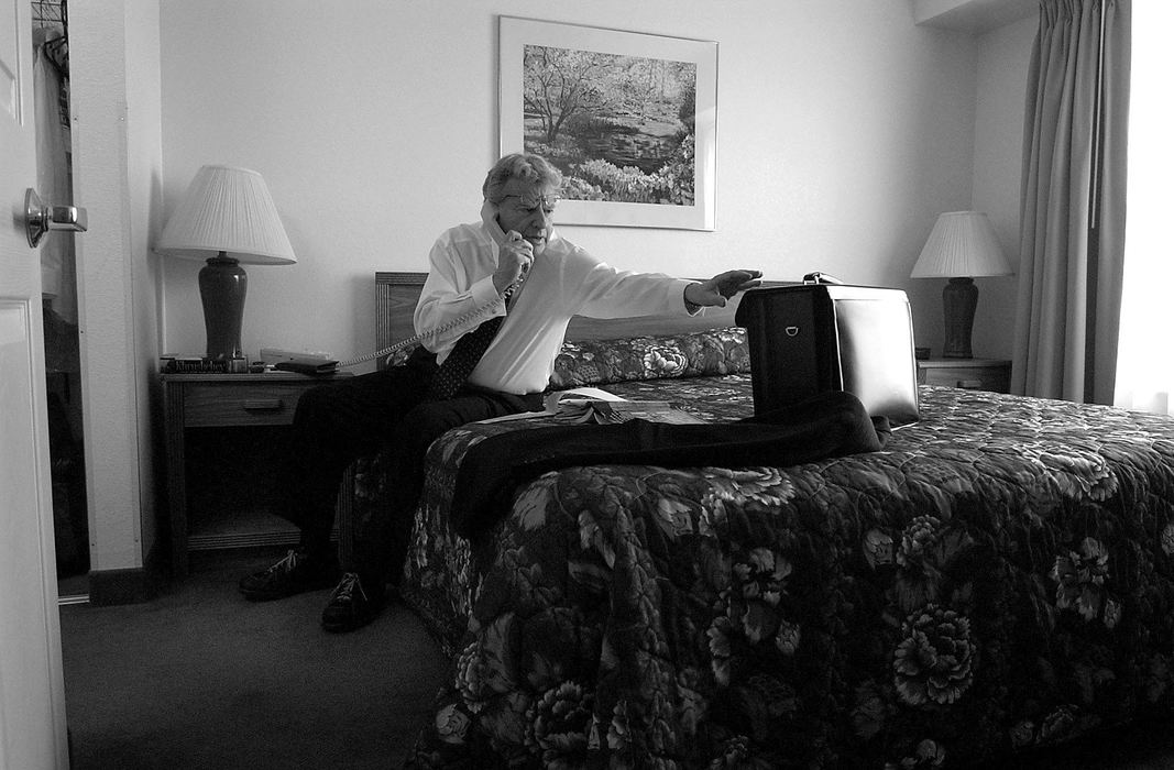 Award of Excellence, Photographer of the Year - Michael E. Keating / Cincinnati EnquirerSpringer makes calls to his travel agent while arranging a trip to Canne, France where he will attend a screening of his movie. On the road, Springer, a frugal man, stayed in a stripped down economy hotel.