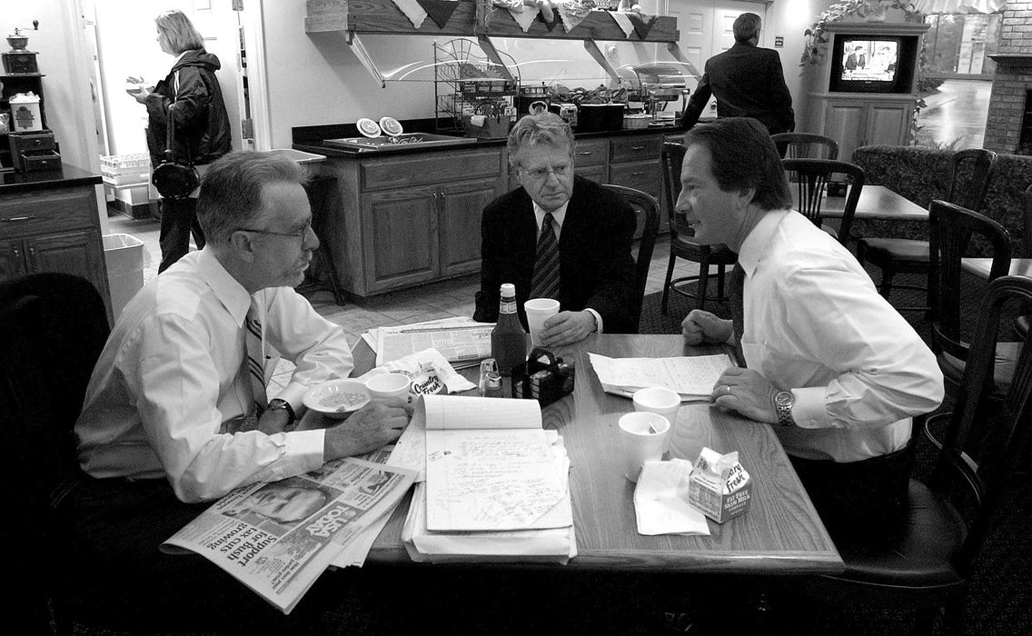 Award of Excellence, Photographer of the Year - Michael E. Keating / Cincinnati EnquirerAn early morning staff (three people including the boss) meeting in the lobby of an economy hotel is the site for planning the day ahead.  Breakfast here is included with the room.