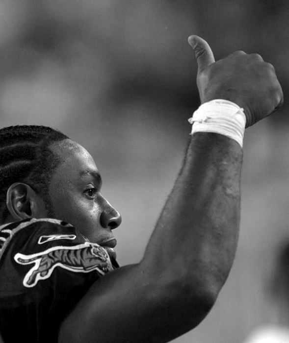 Award of Excellence, Photographer of the Year - Michael E. Keating / Cincinnati EnquirerCorey Dillon flashes a thumbs up to fans in the stands during a preseason game.  Things started off well for Dillon, but soon his mood would turn bitter.