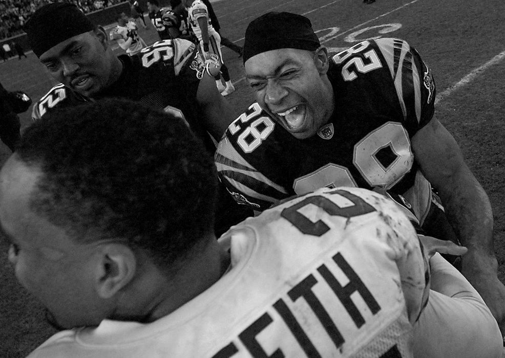 Award of Excellence, Photographer of the Year - Michael E. Keating / Cincinnati EnquirerEven though the Bengals lost their last game and a chance at the playoffs, Dillon was smiling and laughing with the opposition following the game.