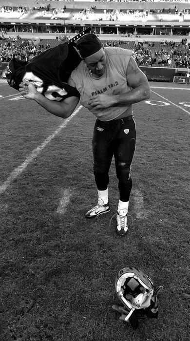 Award of Excellence, Photographer of the Year - Michael E. Keating / Cincinnati EnquirerDillon began stripping away his uniform at mid-field following the loss in the last game of the season.